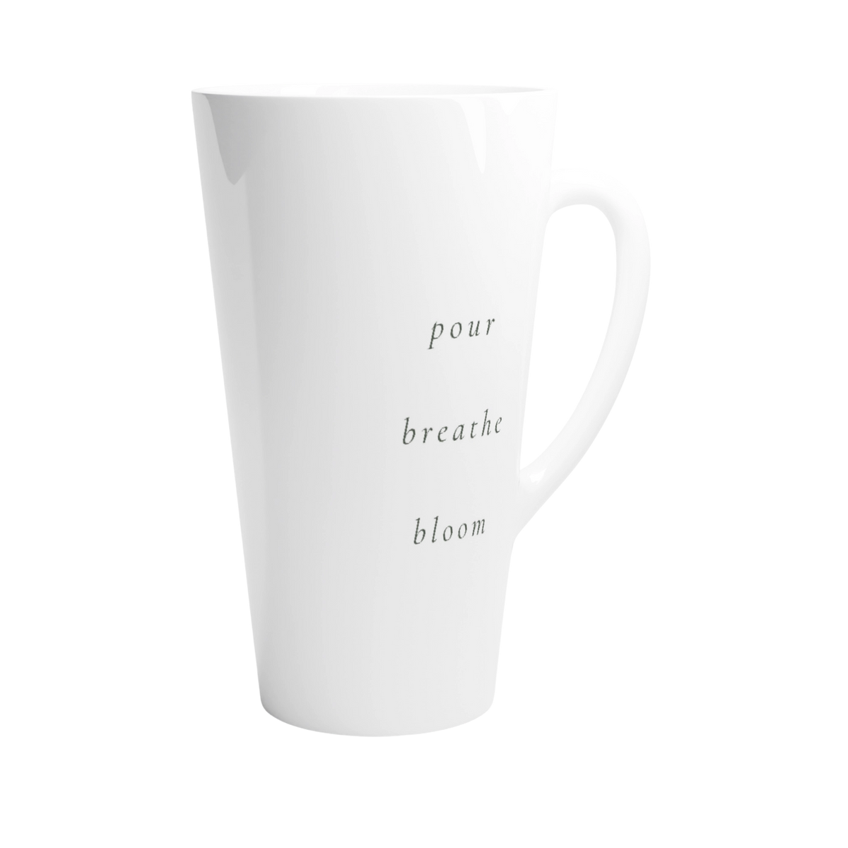A tall white ceramic latte mug with the words 'pour breathe bloom' printed vertically.