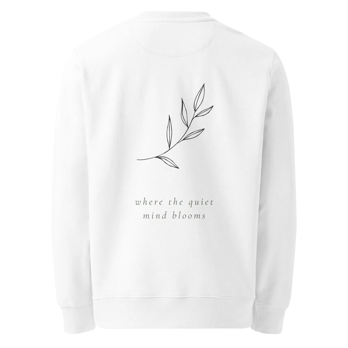 A white crewneck sweatshirt shown from the back, featuring a delicate line art illustration of a leafy branch and the text 'where the quiet mind blooms' printed below it.